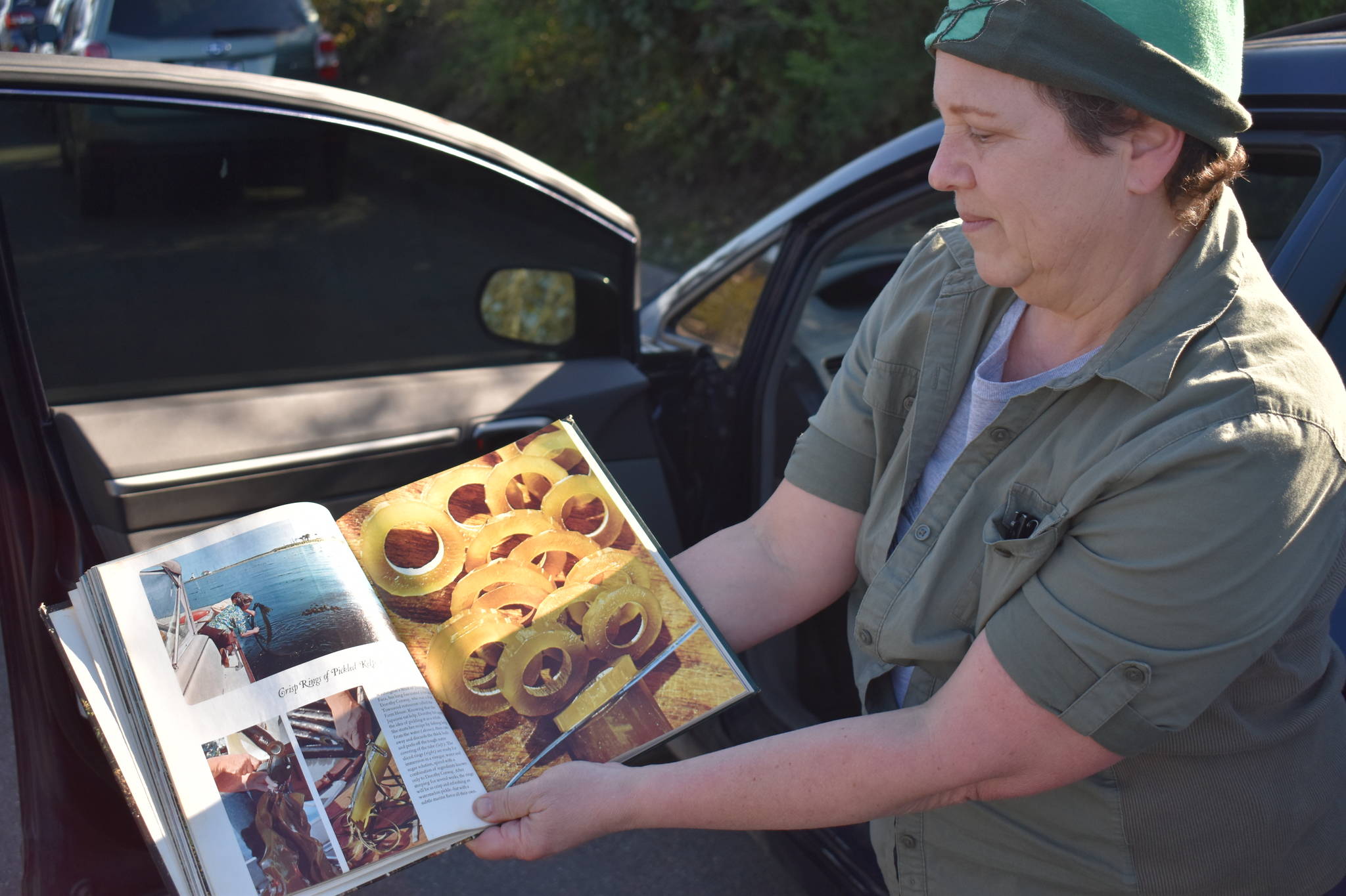 Photos by Emily Gilbert/Whidbey News-Times
Karen Achabal holds an old magazine showing a woman from Port Townsend who makes kelp pickles. Achabal said she has been interested in seaweed harvesting since she first read the story as a kid.