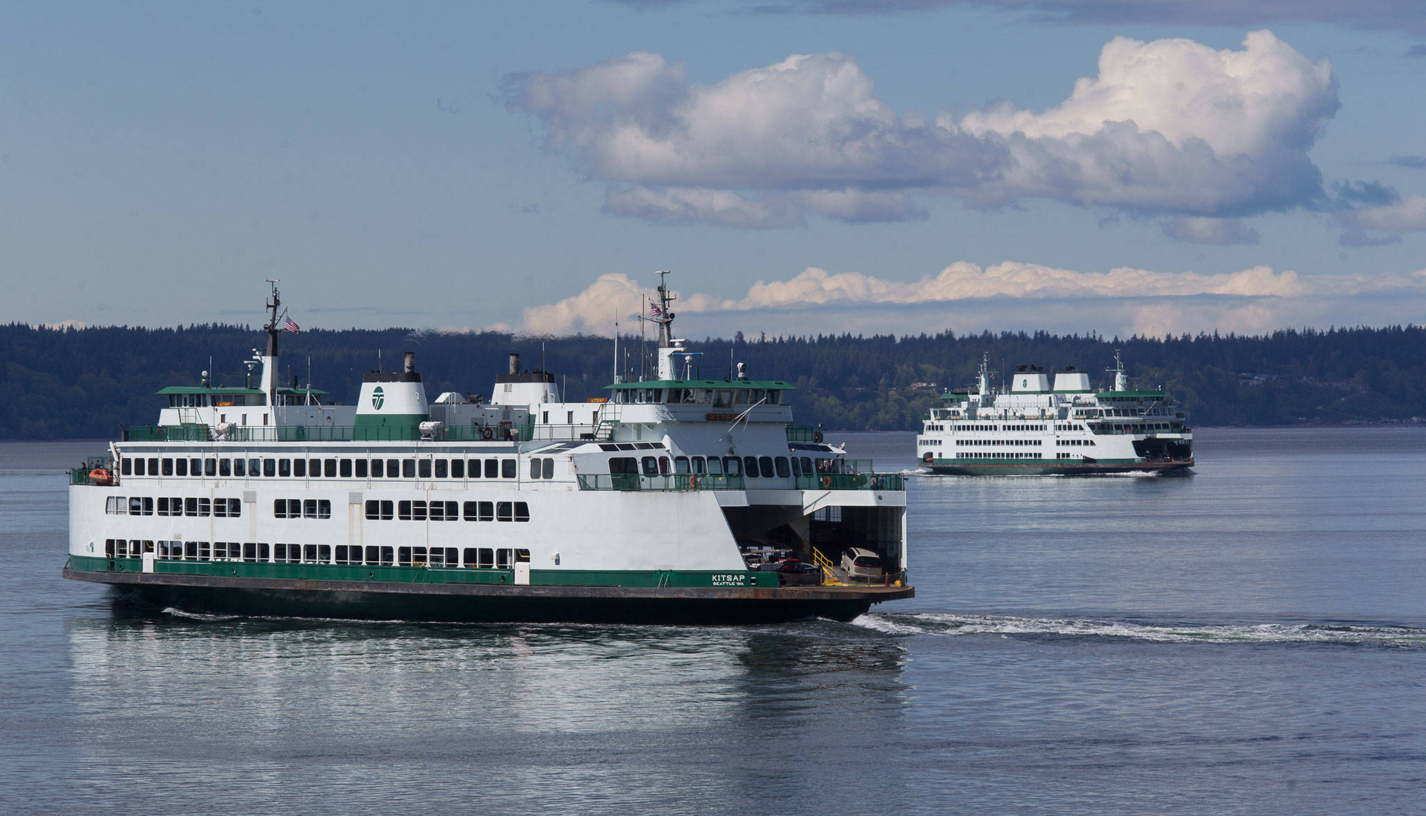 Andy Bronson/Everett Herald file photo
Ferries pass on a crossing between Mukilteo and Whidbey Island.