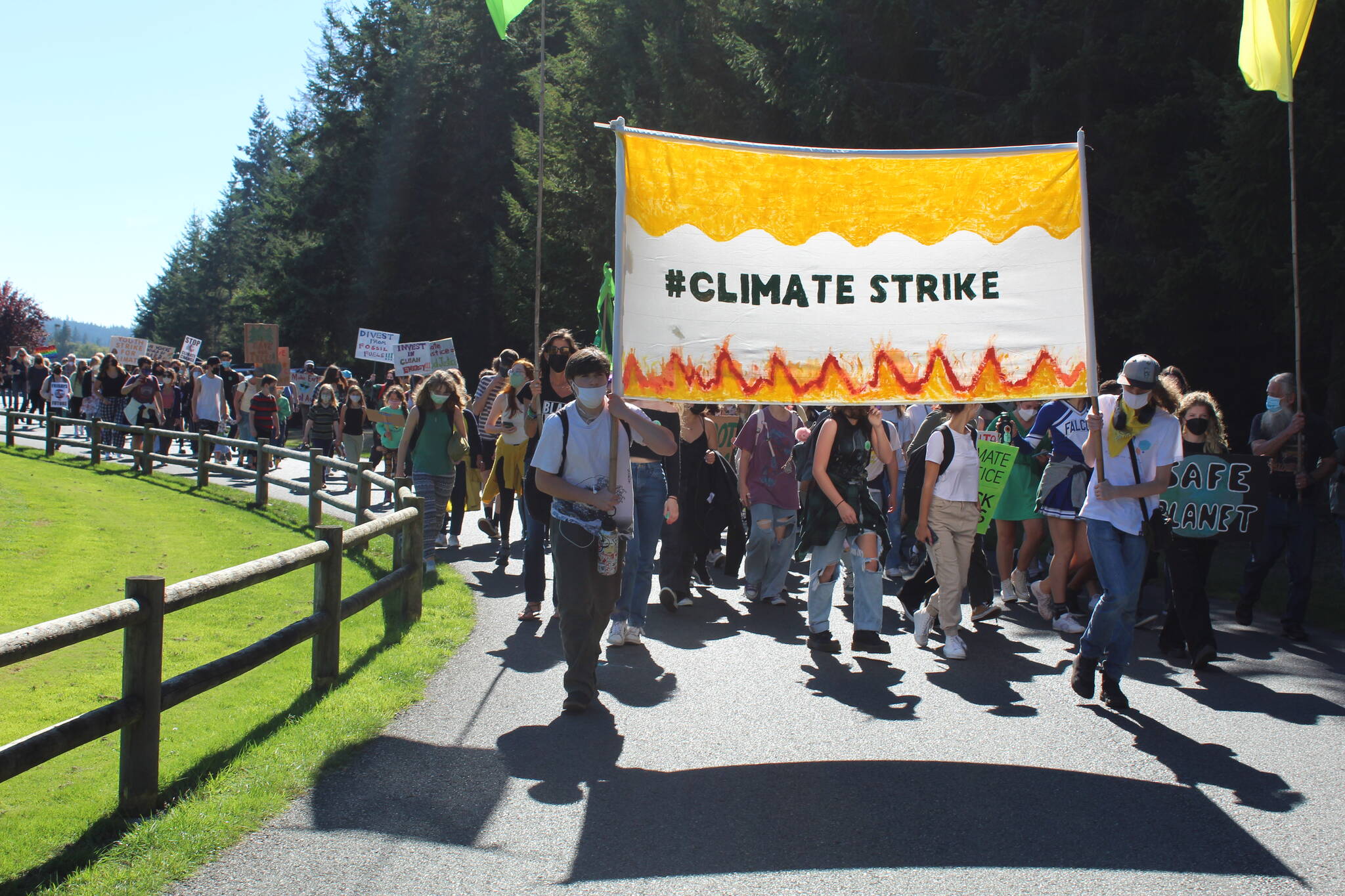 Photo by Karina Andrew/Whidbey News-Times
Students and community members march through Castle Park to demand climate justice.