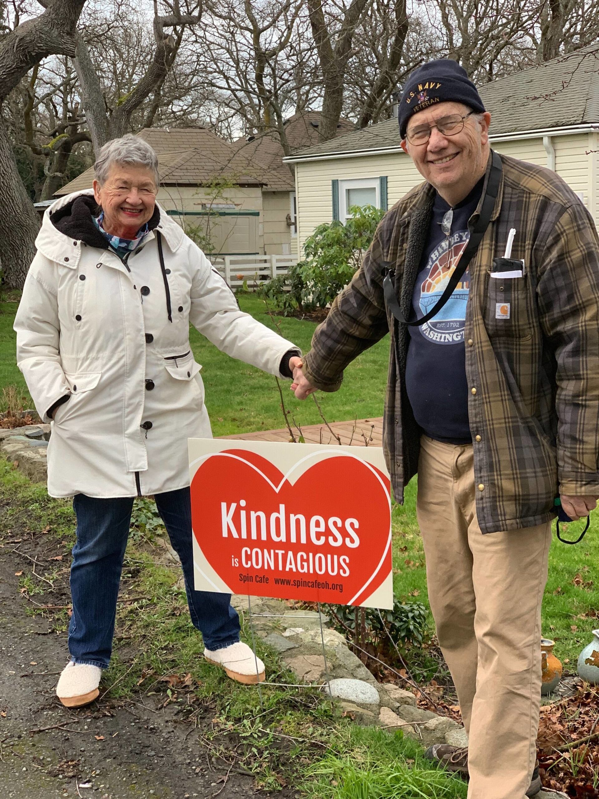 Photo provided
Carol and Bob Wall display a “Kindness is Contagious” sign from the campaign they founded to promote civil discourse.