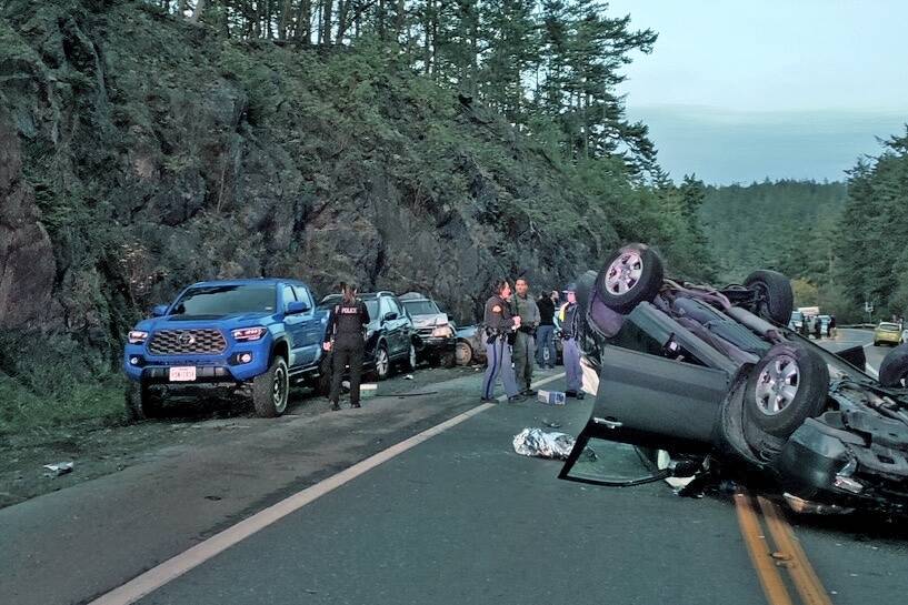 Photo provided
A car rolled over south of Deception Pass and struck several parked cars. It was the second car accident in the area on Sunday.