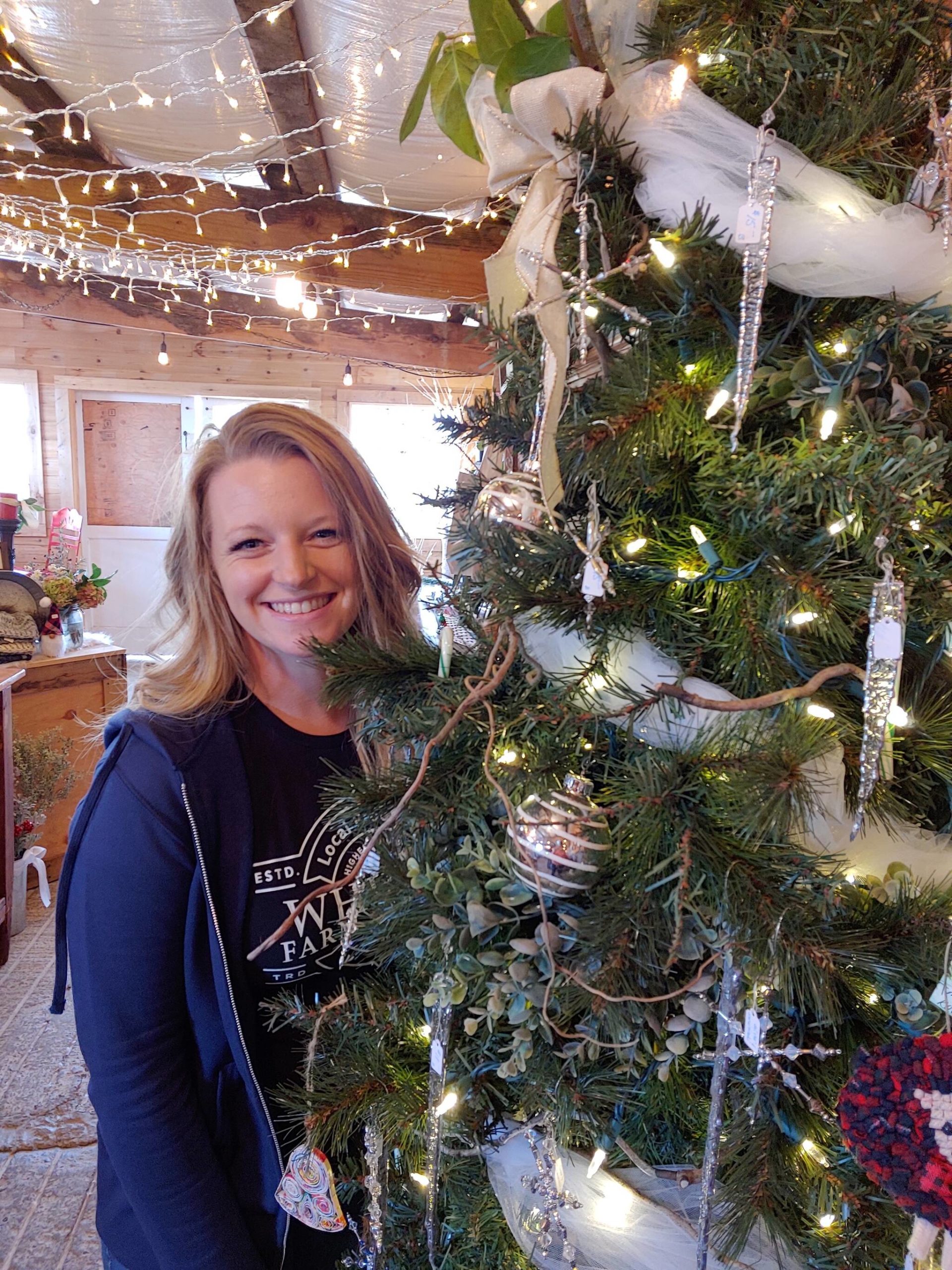 Photo provided
Whidbey Farm and Market is partnering with local nonprofits to help provide Christmas for island families. Above, Shannon Hamilton helps spread Christmas cheer in the market shop.