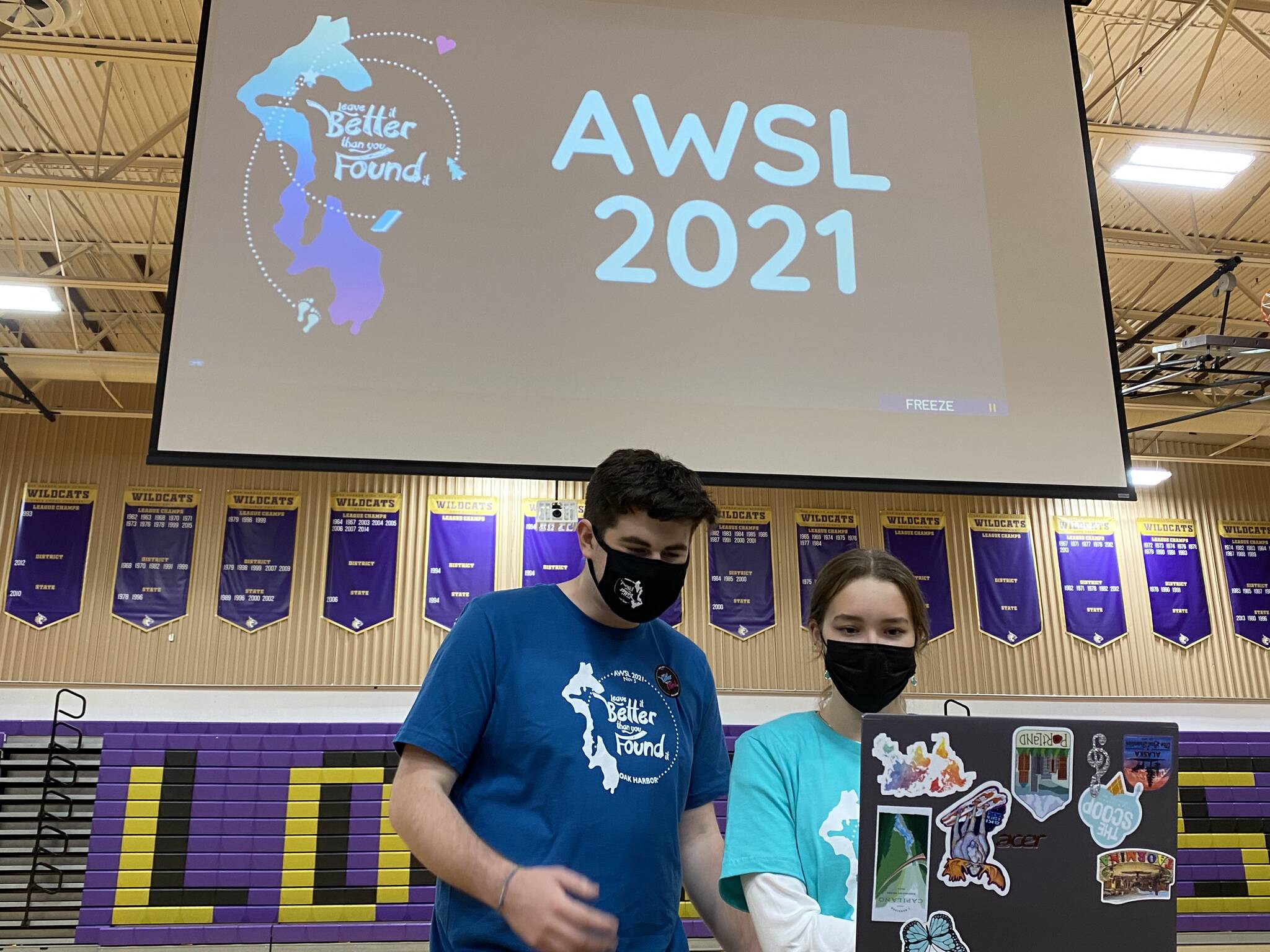 Photo provided
Kyle Hucko and Isadora White, two of the primary hosts of the conference, get set up at the high school.