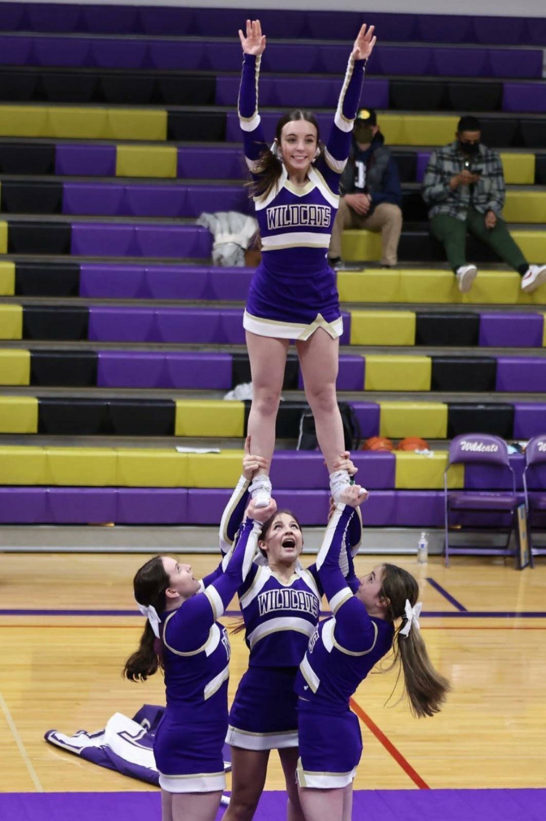 Photo provided
Cassidy Gore, bottom left, and Ava Vallencourt, top, cheer at a basketball game.