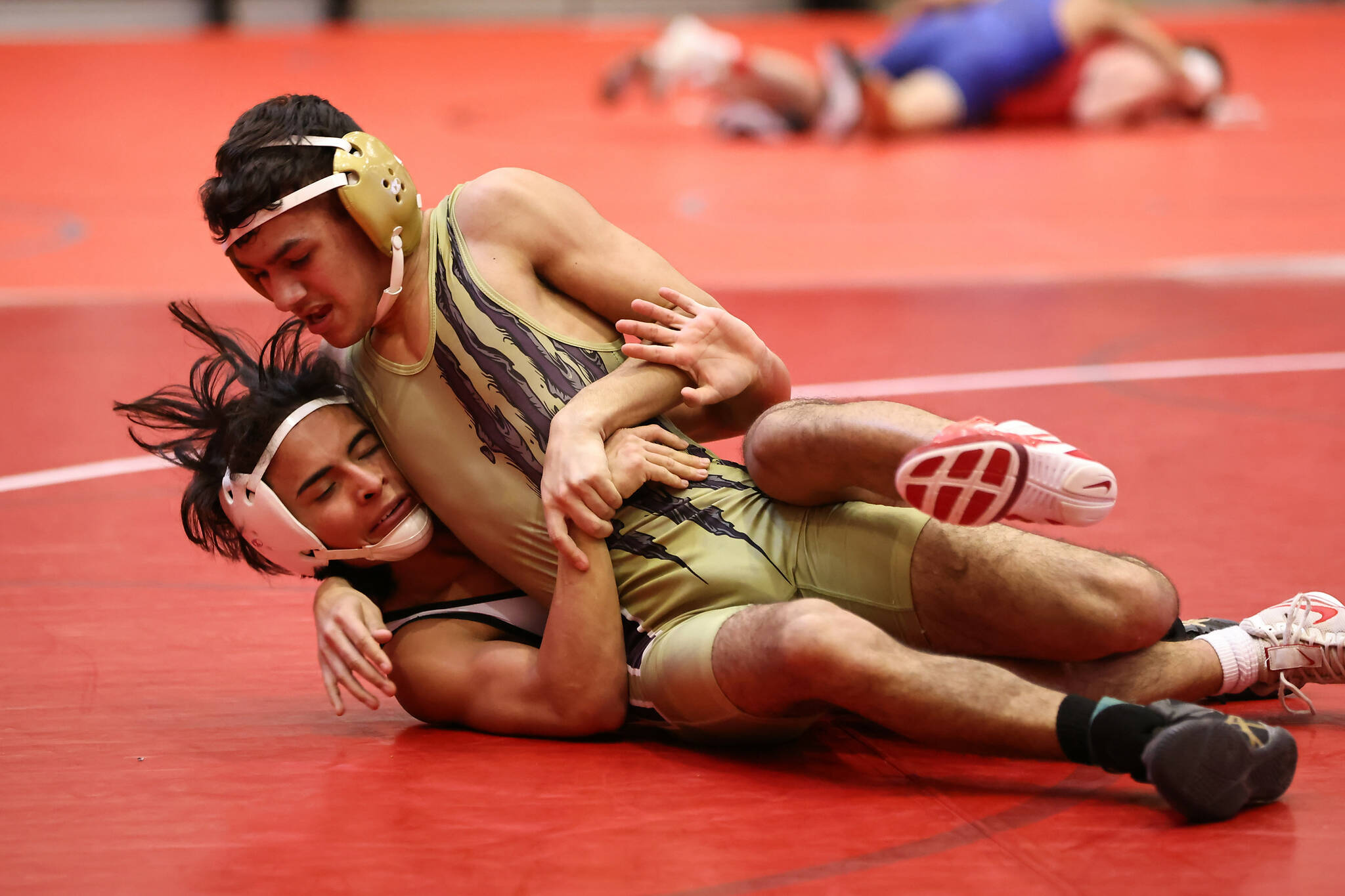 Photos by John Fisken
Junior Brendan Doria upsets the number two seed at the sub-regionals wrestling tournament Feb. 4 in Stanwood.