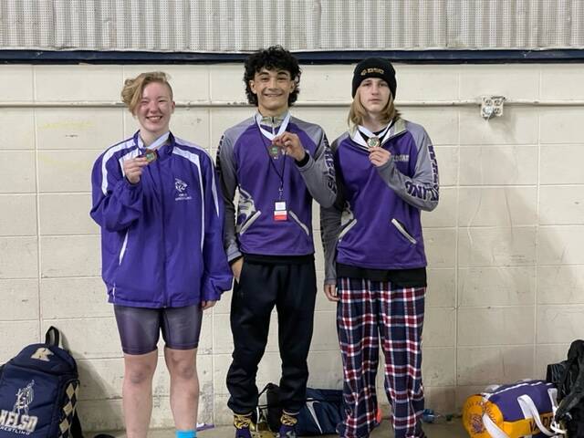Photo provided
From left, Alyssia Grose, Cole Valdez and Percie Hatfield of Oak Harbor show off their medals.
