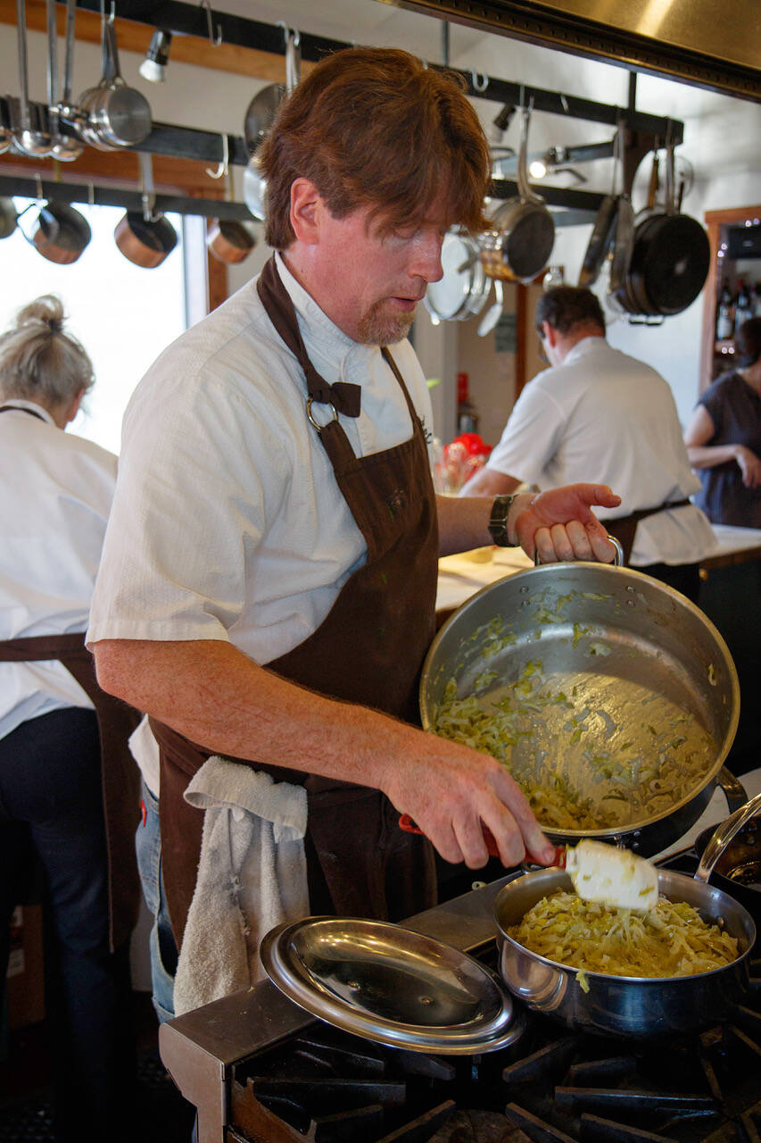 Photo by David Welton
Vincent Nattress prepares food at the Orchard Kitchen restaurant, which is where the chandelier will hang