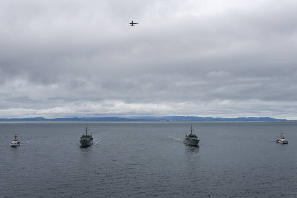 Photo by Petty Officer 2nd Class Steven Strohmaier
A U.S. Navy P-8 Poseidon Naval Air Station Whidbey Island aircraft flies over U.S. Coast Guard Cutter Blue Shark and U.S. Coast Guard Cutter Osprey as they transit alongside HMCS Saskatoon and HMCS Yellowknife from the Royal Canadian Navy during a joint exercise in the Salish Sea on Feb. 17.
