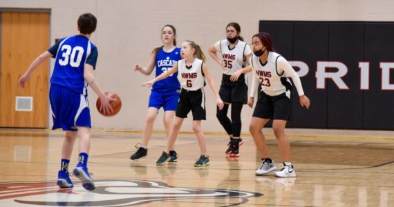 Photo by Conor Laffey
From left, North Whidbey Middle School eighth graders Annalise Wesley, Allena Locklear and Zoe Scott face off against Cascade Middle School athletes in the final game of the season.