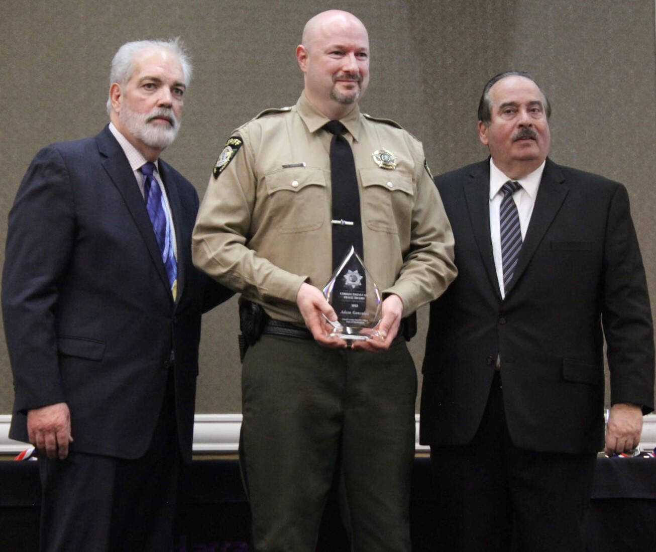 Photo provided
Deputy Adam Gonzalez, center, is pictured with Corrections USA Vice Chairman Roy Pinto, left, and Corrections USA President Jim Baiardi, right, during the awards banquet on Wednesday Feb. 16, where he was awarded the Corrections USA Image Award.