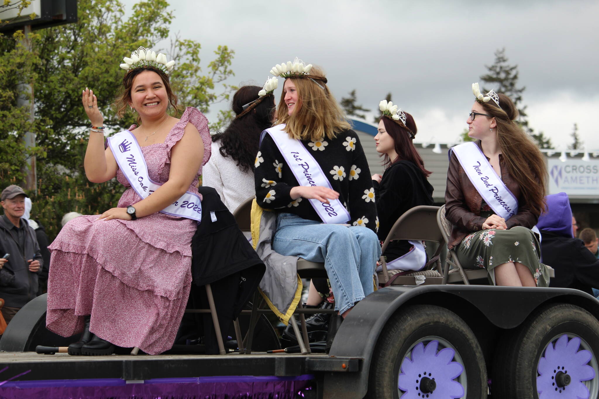 Miss Oak Harbor Thinalyn Ramier and her court ride by on a float. (Photo by Karina Andrew/Whidbey News-Times)