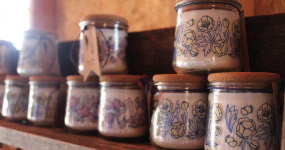 Upcycled Crow Cottage candles are among the new wares sold at Whidbey Farm and Market this season. (Photo by Karina Andrew/Whidbey News-Times)