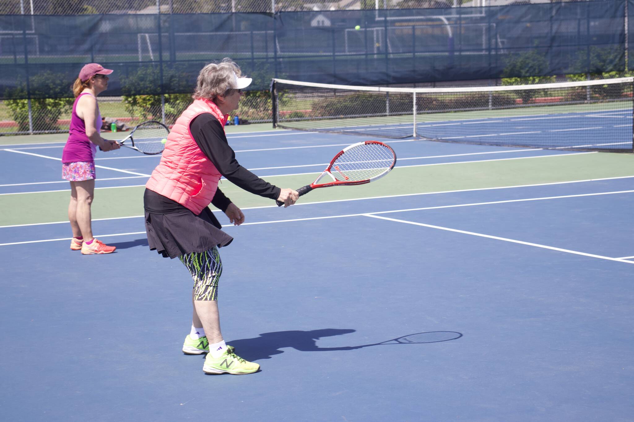Barbara Niedzialkowski, an Oak Harbor Racket Club member, in a game of doubles tennis. (Photo by Rachel Rosen/Whidbey News-Times)