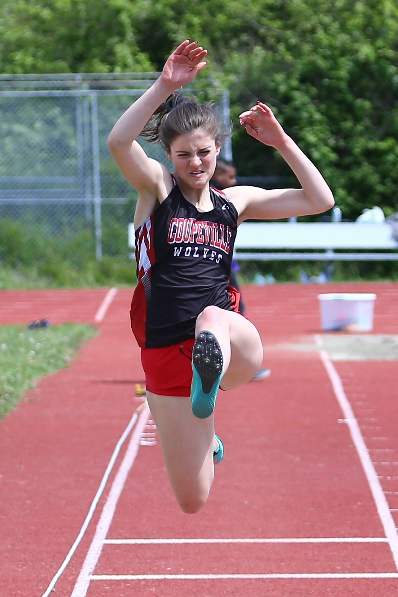 Junior Ryanne Knoblich competes in the long jump. She earned second place in this event with a distance of 15 feet, a personal record for the athlete. She also first place in the high jump with a height of 4 feet, 10 inches. (Photo by John Fisken)