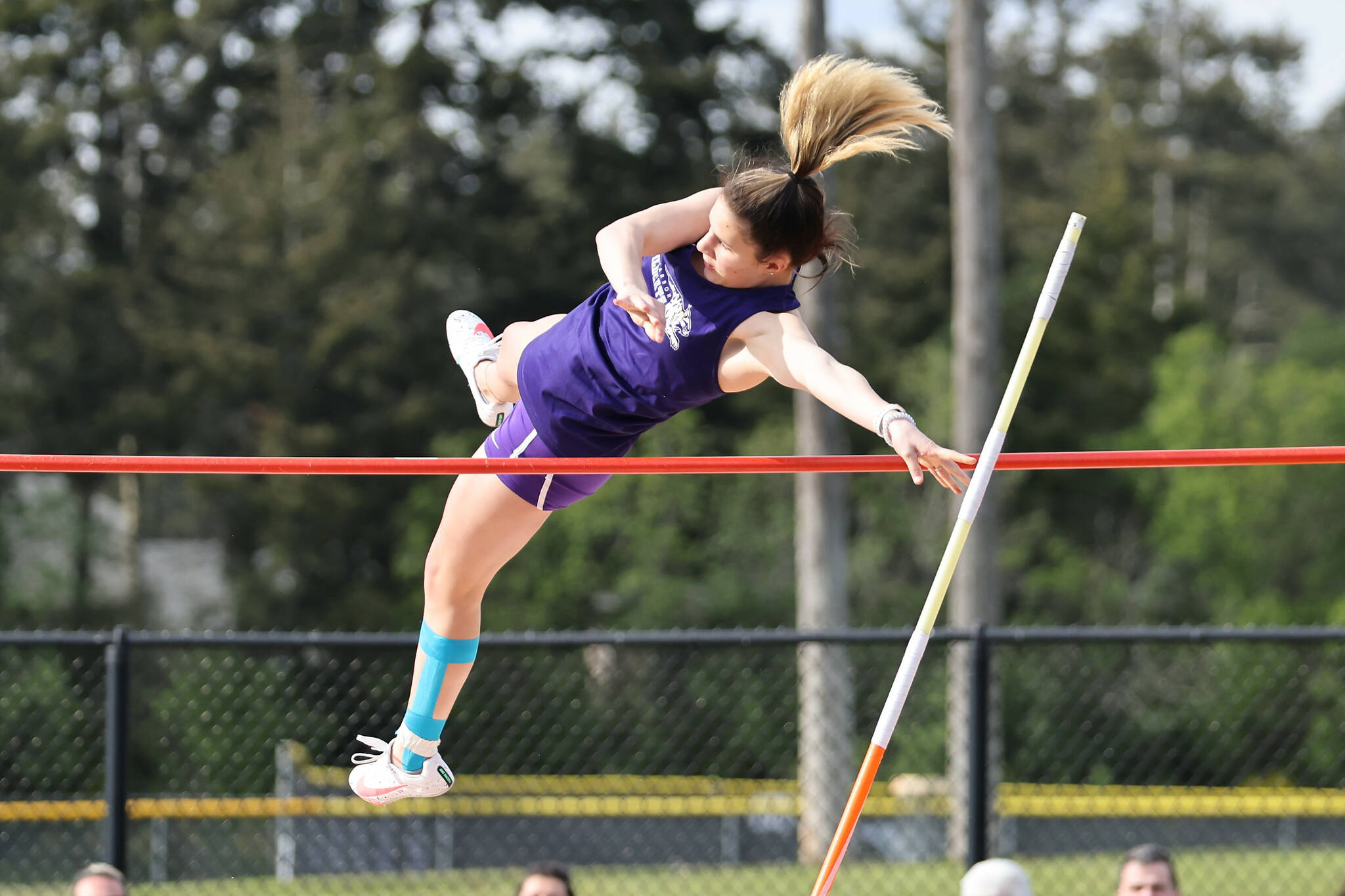Photo by John Fisken
Sophomore Natalie Chadduck competes in the pole vault event. She won first place with a height of eight feet.