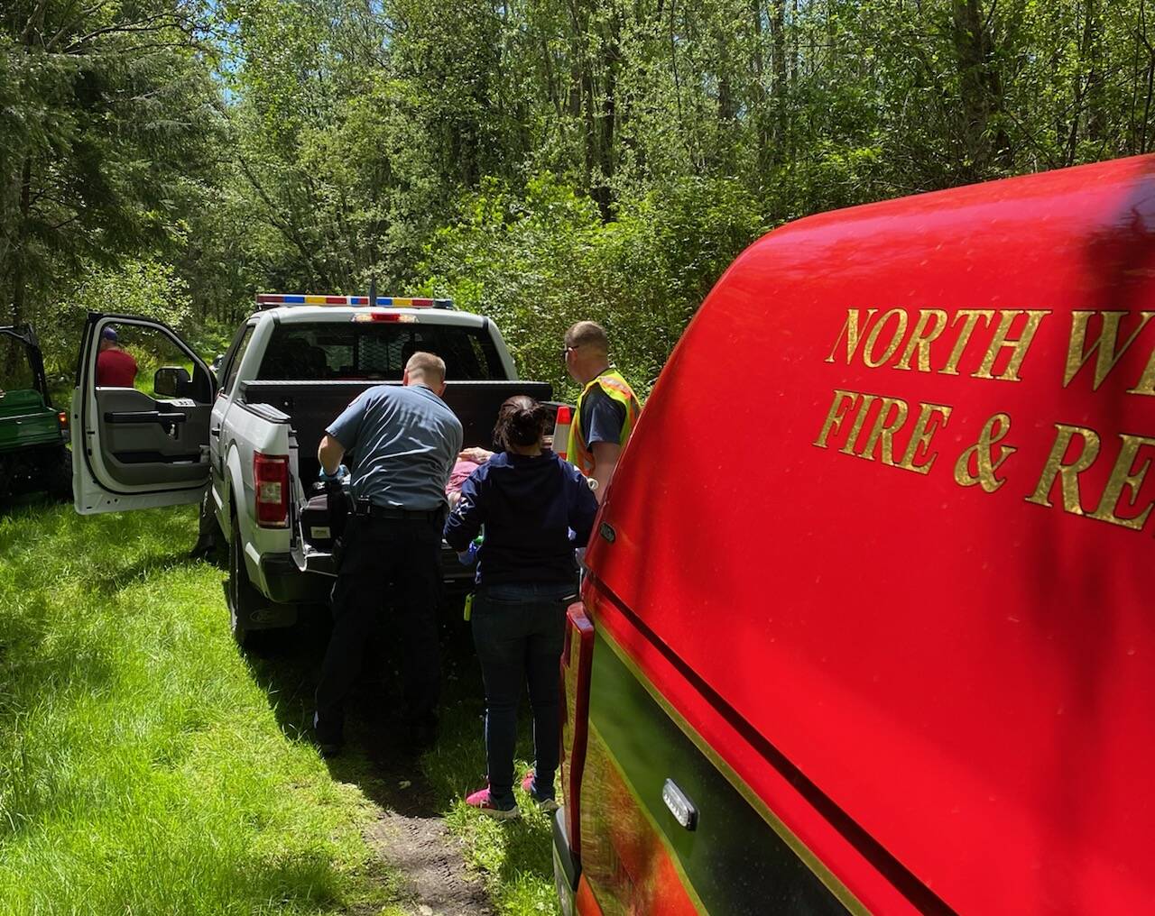 North Whidbey Fire and Rescue photo
First responders load a woman with potential injuries into a vehicle after she was thrown from a horse Thursday morning.