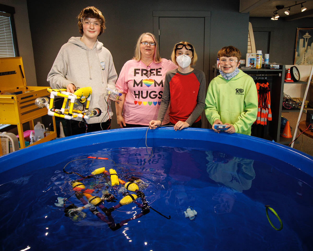 From left to right, Teddy Alexander, Ash Bystrom, Solomon Hilliard and Caleb Arndt with two ROVs built by Etta Cameron and Maisie Pendell and Turner Pendell, Nick Hammond and Charlie Cameron. (Photo by David Welton)