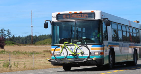 An Island Transit bus drives in a rural area. (Photo provided by Island County Transit)