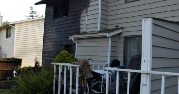 The back of an Oak Harbor duplex was scorched in a fire Saturday. (Oak Harbor Fire Department photo)
