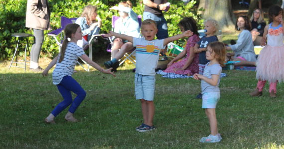 Photo by Karina Andrew/Whidbey News-Times
Children dance to the live music at the Deception Pass 100th anniversary community picnic.
