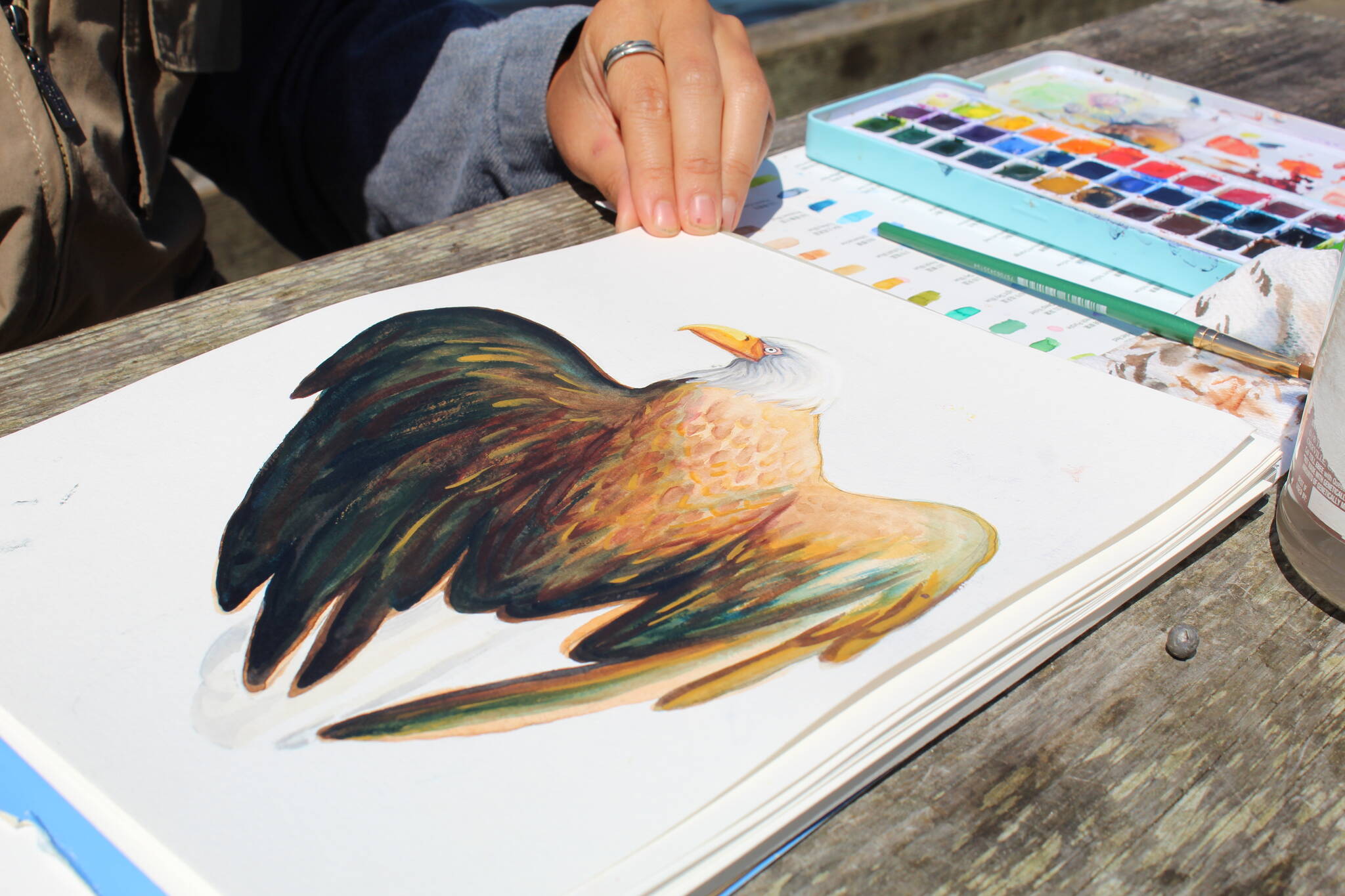 Photo by Karina Andrew/Whidbey News-Times
Nina Vichayapai shows her watercolor painting of an eagle.