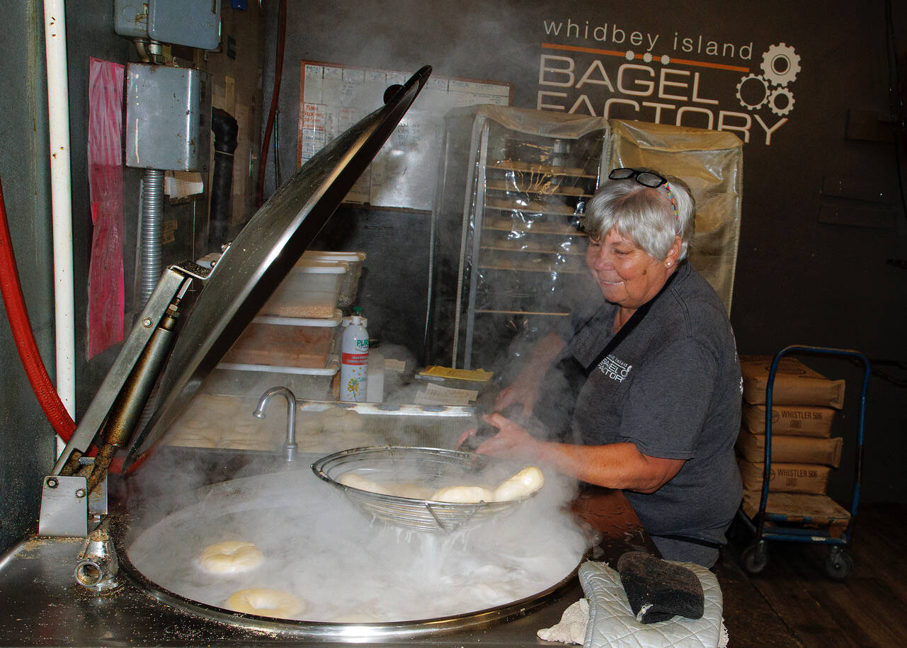 Carol Forgas boils bagels. (Photo by David Welton)