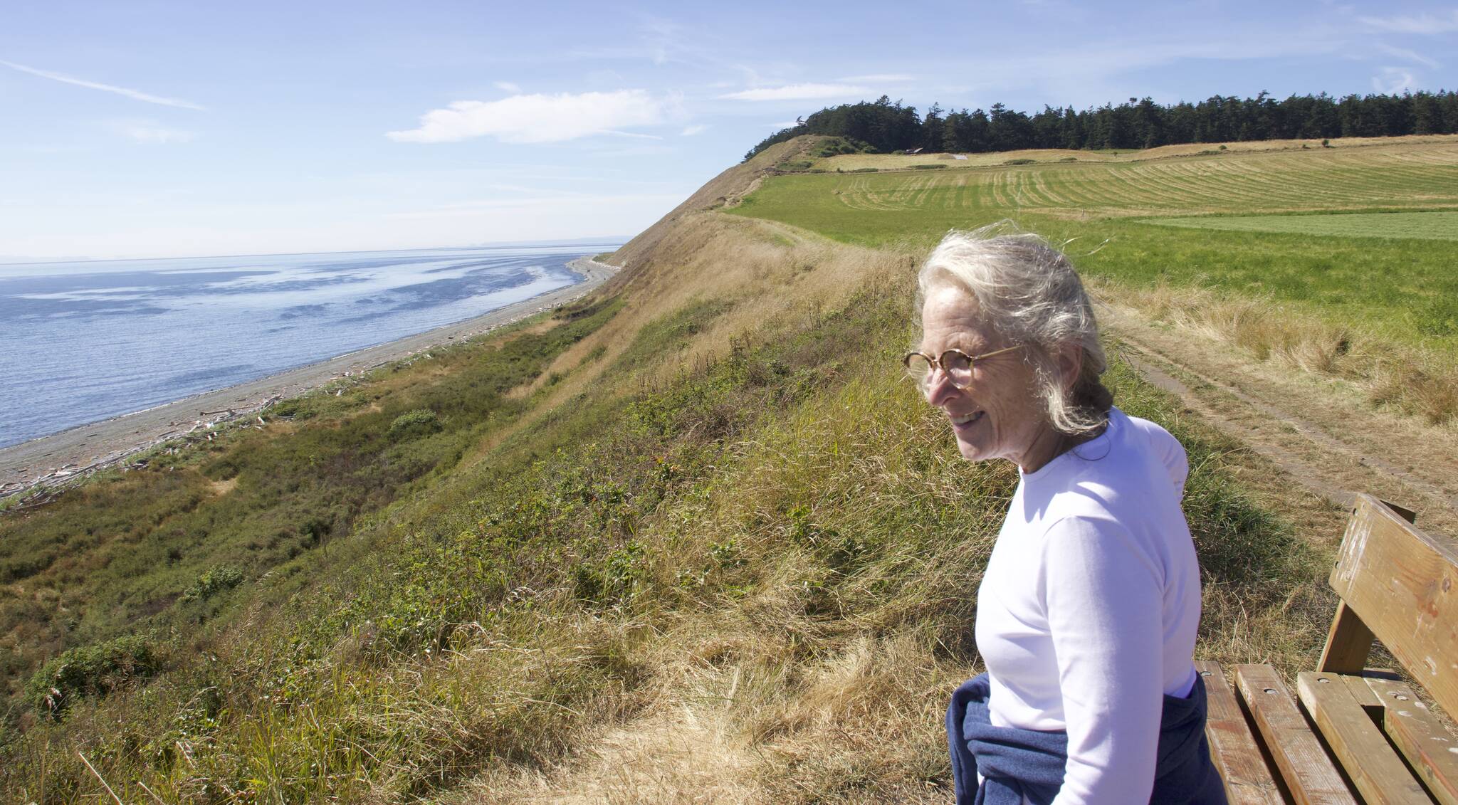 Lynn Hyde, director of Historic Whidbey, looks over Ebey's Landing where the history walk is taking place. (Phot by Rachel Rosen/Whidbey News-Times)