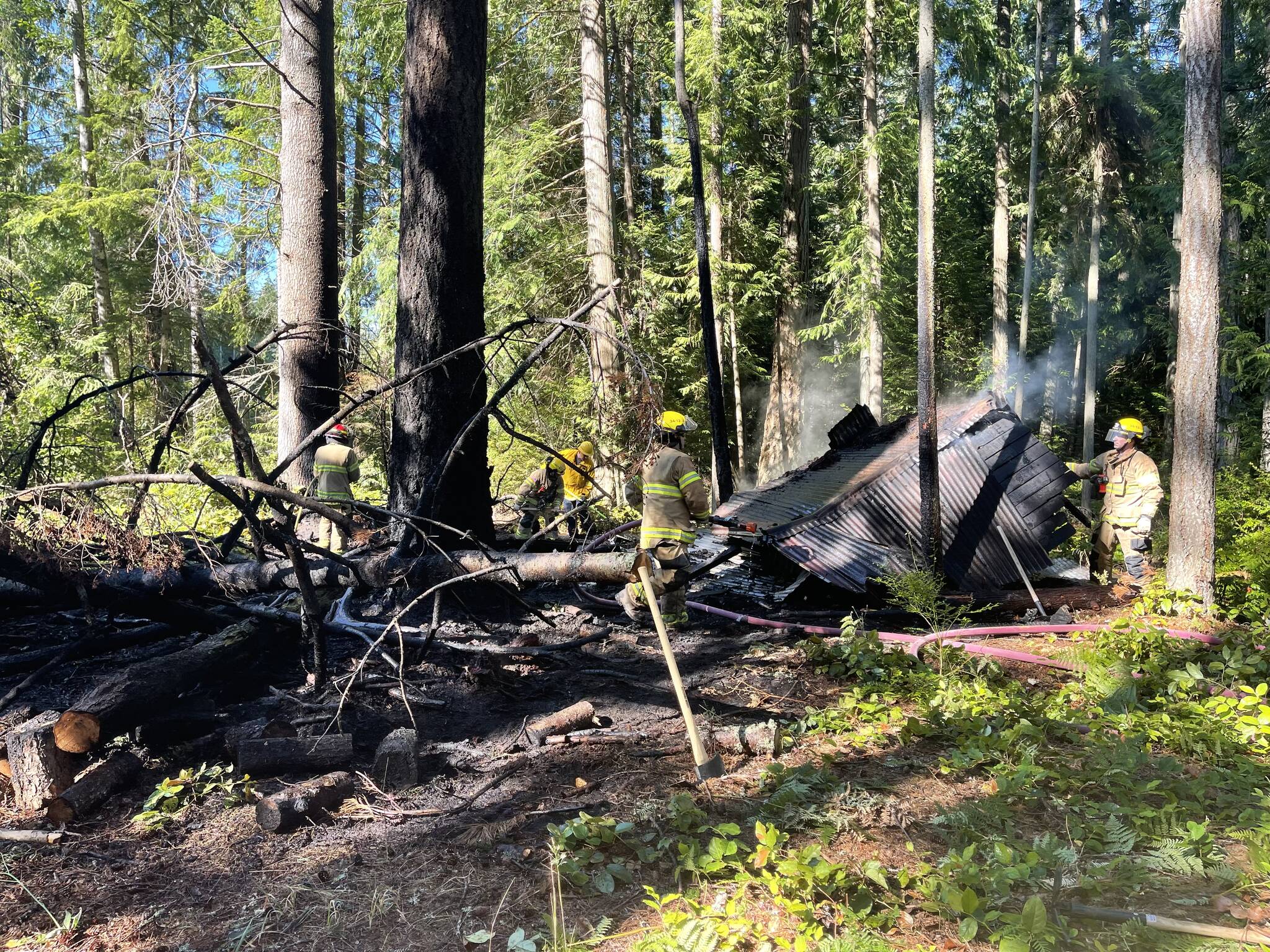 Photo provided
Firefighters from South Whidbey Fire/EMS responded Sunday to a fire in the woods behind the Bayview Cemetery.