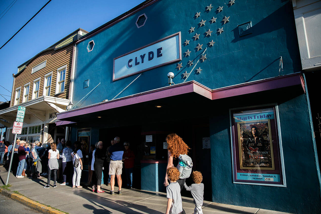 People line up outside of the Clyde for the premier showing of Elvis on Friday, July 8, 2022 in Langley, Washington. (Olivia Vanni / The Herald)