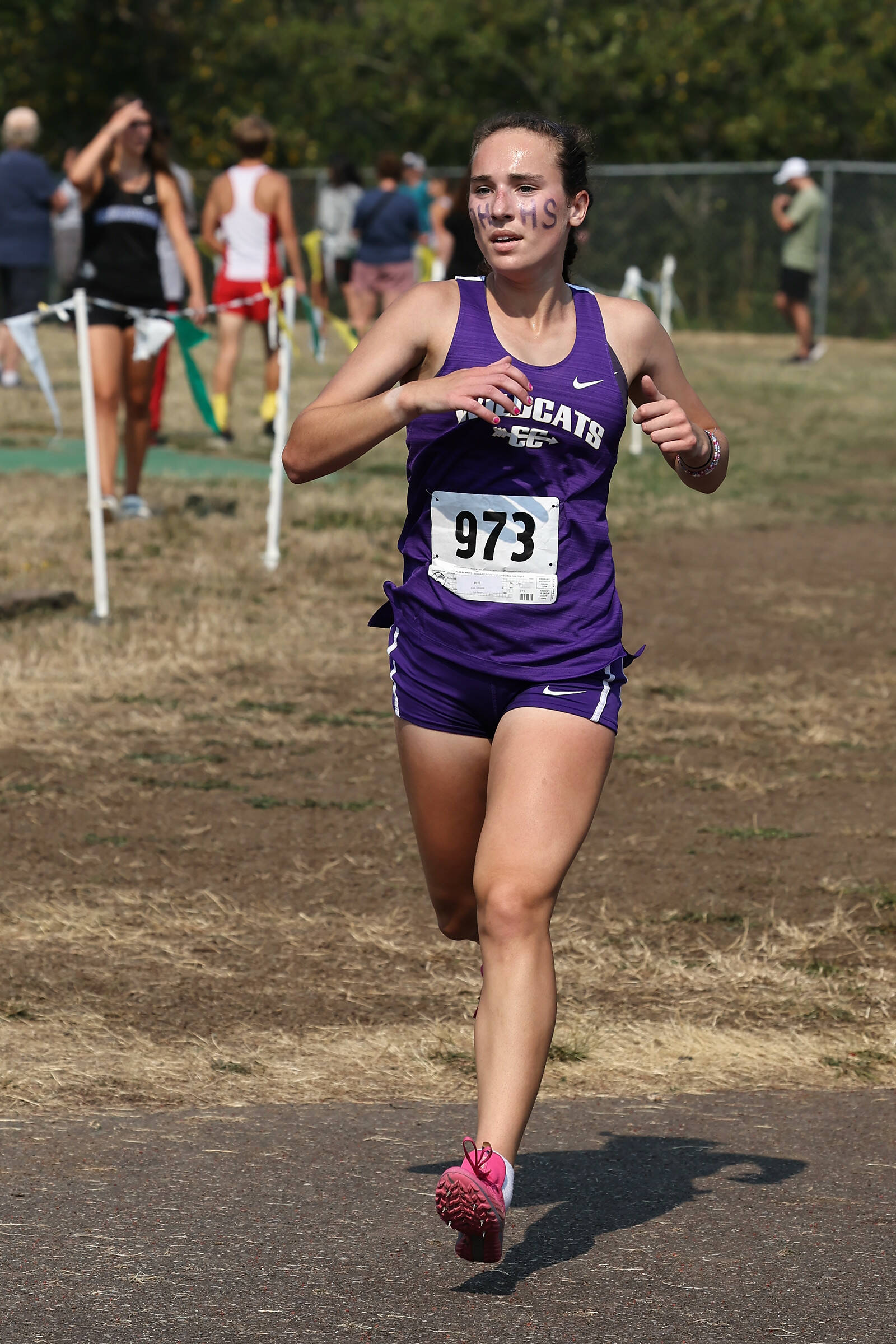Photo by John Fisken
Oak Harbor High School runner Adrienne Root finished third overall in the 2 Miles Senior cross country race on Sept. 10 at the Sehome Invite at Bellingham’s Civic Stadium. All three Whidbey Island schools participated. Her time was 12.09.99.