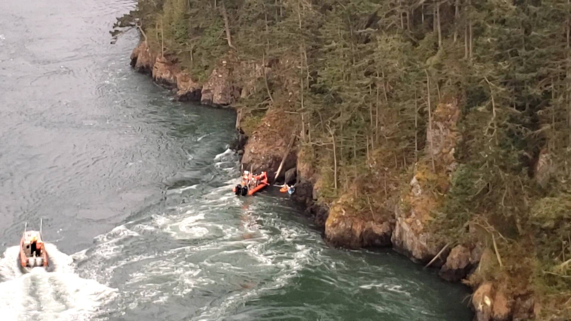 Image provided
A screenshot from a North Whidbey Fire and Rescue video shows Marine Search and Rescue vessels assisting two kayakers who were swept out of Cornet Bay by the strong currents under Deception Pass bridge Sept. 11.