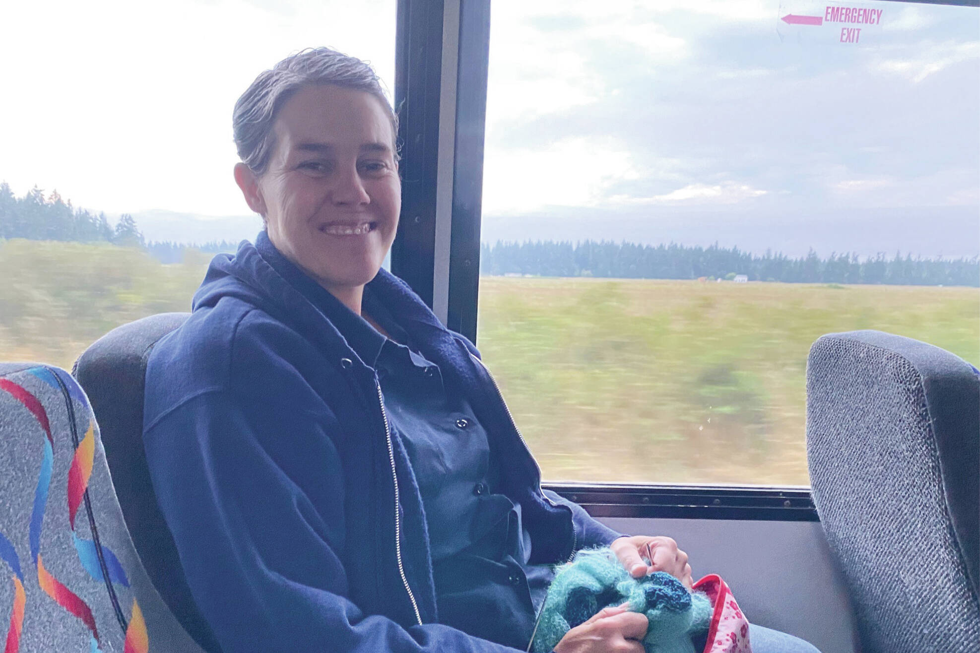 Michele knits and listens to music during her weekday Island Transit commute for her work with the Public Health Department.