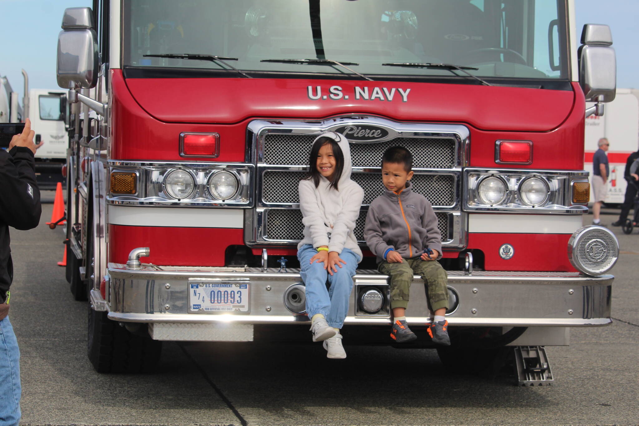 Photo by Karina Andrew/Whidbey News-Times
Kids pose for a photo on a Navy fire truck.