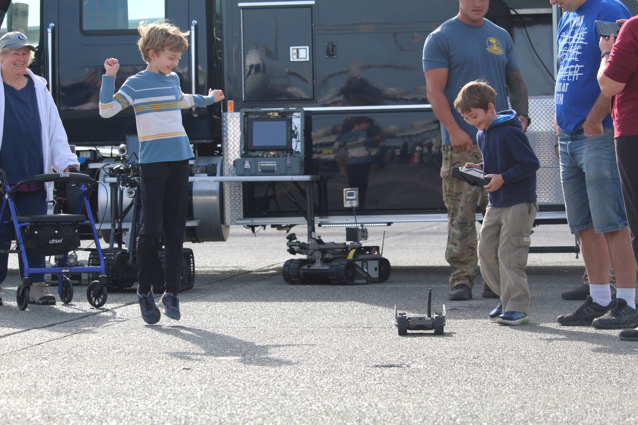 Photo by Karina Andrew/Whidbey News-Times
Kids play with a remote controlled vehicle at the base open house.