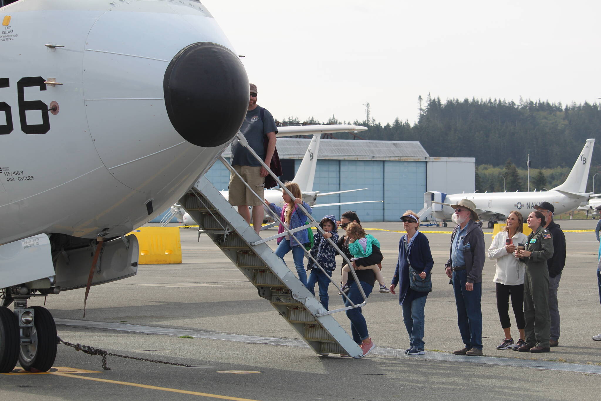 Photo by Karina Andrew/Whidbey News-Times
Families wait in line to tour a Navy aircraft.