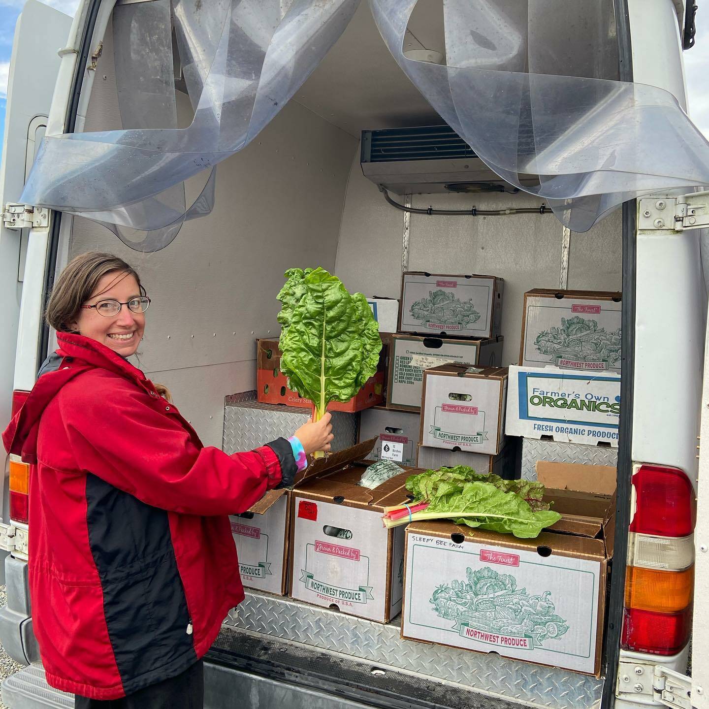 Photo provided
Shannon Bly, coordinator for Whidbey Island Grown Cooperative, stands in front of a truck-full of orders that are distributed to four different locations on the island.