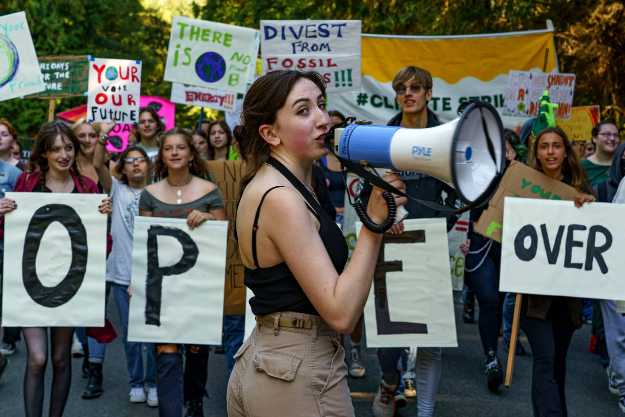 Photo by David Welton
South Whidbey High School student Molly Nattress leads protesters in a march for climate justice.