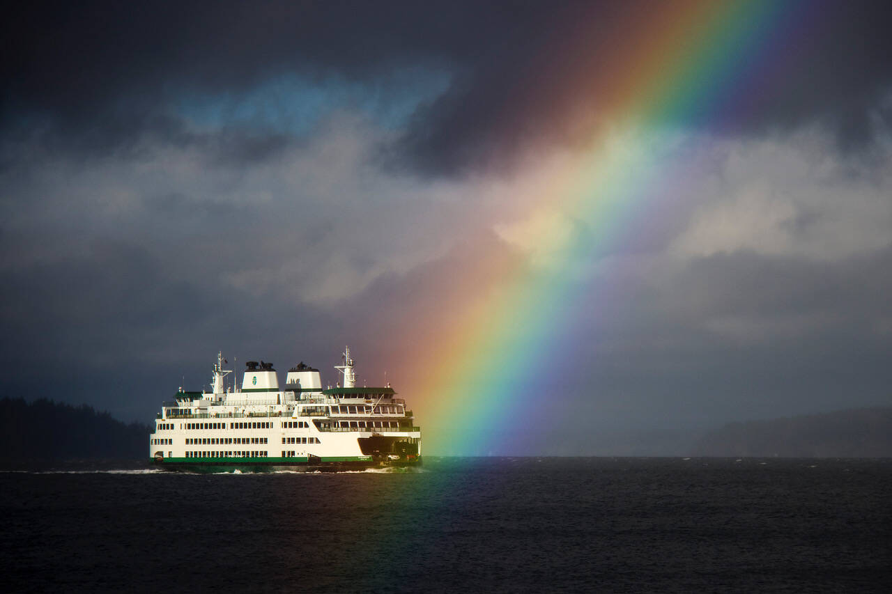 David Welton’s photo of a rainbow appearing to strike a ferry was awarded in the WNPA contest.