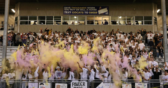 Photo by John Fisken
Oak Harbor High School had its homecoming football game on Oct. 7 at Wildcat Memorial Stadium. As has been tradition since 2015, students throw powder into the air to celebrate the event.