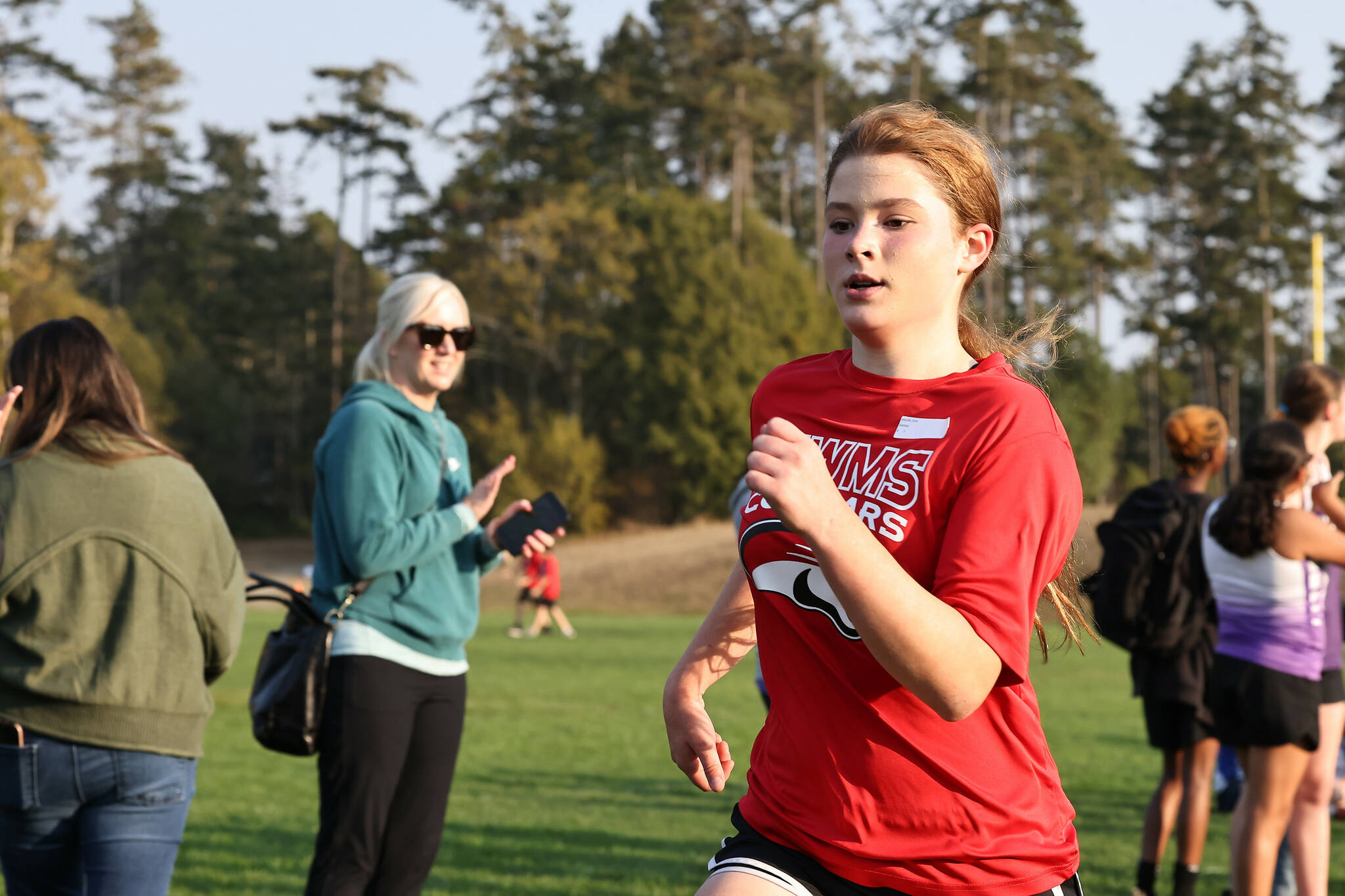 Photos by John Fisken
North Whidbey Middle School eighth grader Eva Bazar runs in the final cross country meet of the season in Oak Harbor on Tuesday. She finished 17th in her race.