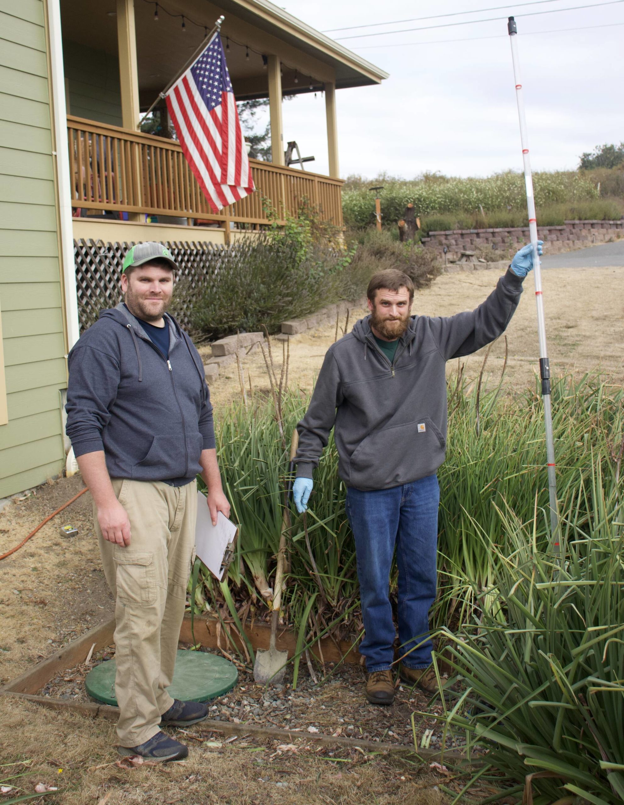 Photo by Rachel Rosen/Whidbey News-Times
Ben Miller (left) and his brother Seth (right) own Whidbey Septic. Their business involves inspecting and maintaining septic systems. Seth holds a core sampler that is used to see the contents of a septic tank.