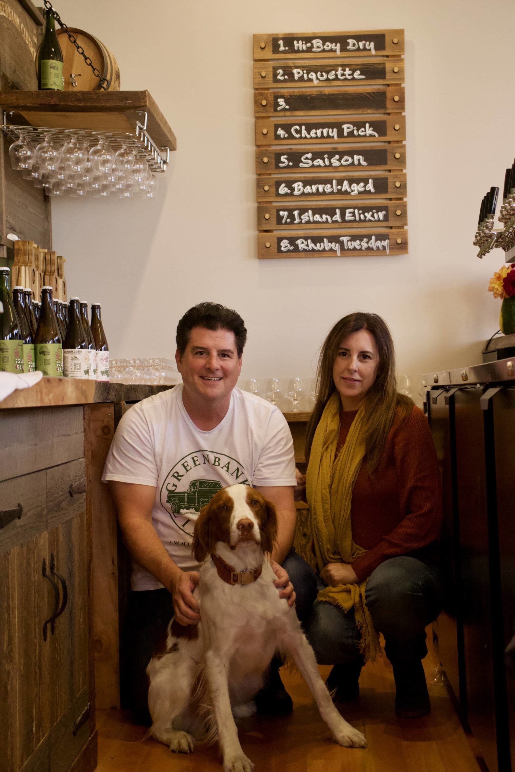 Photo by Rachel Rosen/Whidbey News-Times
Jeff Stoner, Kim Taylor and their dog Tate. Greenbank Cidery’s taproom allows friendly dogs.
