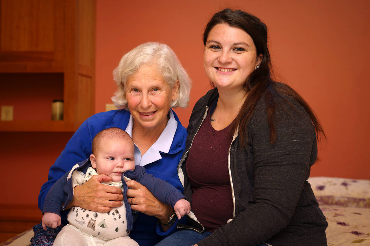 Photo by David Welton
Midwife Cynthia Jaffe, left, closed the Greenbank Birth Center in August and officially retired in October after her last postpartum check-up. She delivered both Bailey Pace, right, and Pace’s 2-month-old son, Tommy.