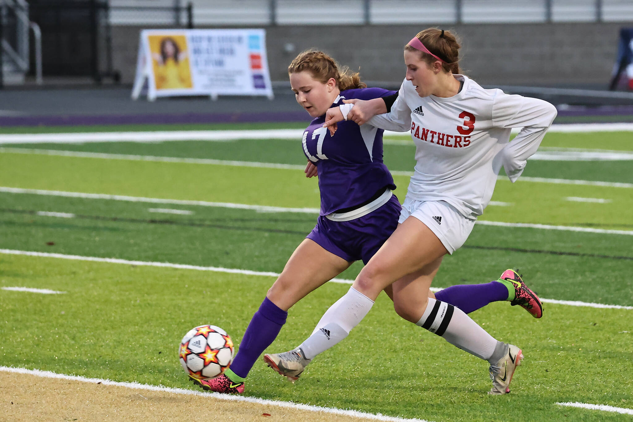 Junior Anna Suto races for the ball in a playoff game against Snohomish Oct. 29. (Photo by John Fisken)