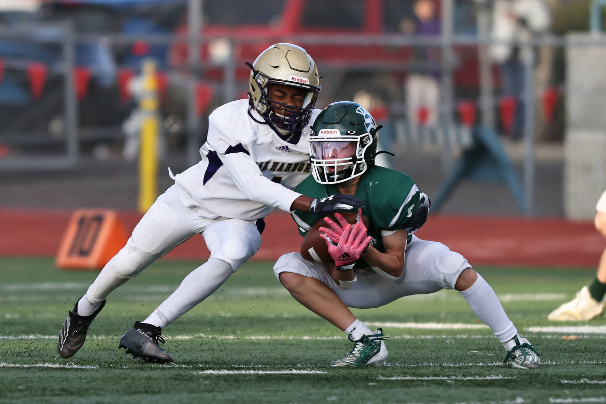 Taiis Hardin tackles an opponent during the playoff game at Edmonds Oct. 28. (Photo by John Fisken)