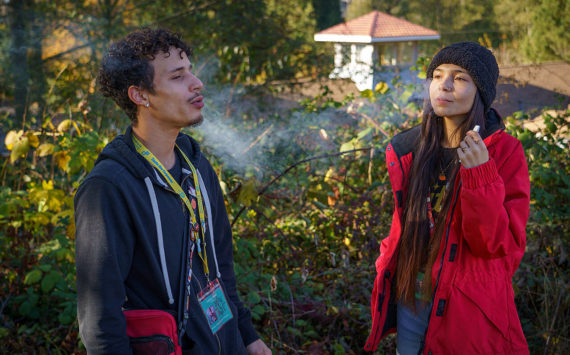Photo by David Welton
Whidbey Island Cannabis budtenders Anthony Banks and Kati Sinclair enjoy a puff on their work break.