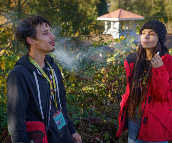 Photo by David Welton
Whidbey Island Cannabis budtenders Anthony Banks and Kati Sinclair enjoy a puff on their work break.