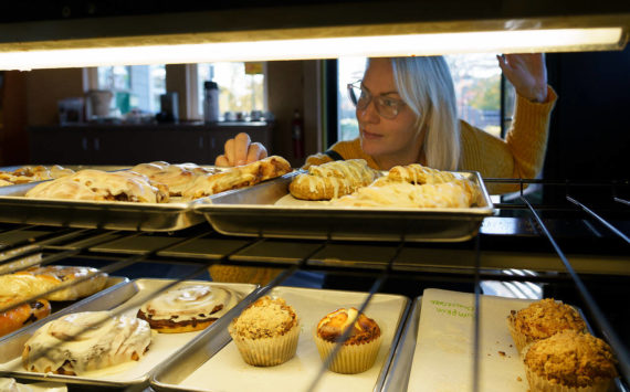 Photo by David Welton
Angie Lambert-Jackson checks the display case at Cedar & Salt. All baked goods at the cafe are made from scratch and feature many local ingredients.