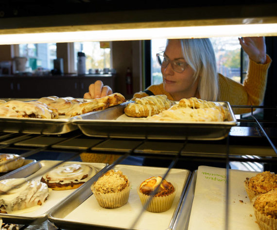 <p>Photo by David Welton</p>
                                <p>Angie Lambert-Jackson checks the display case at Cedar & Salt. All baked goods at the cafe are made from scratch and feature many local ingredients.</p>