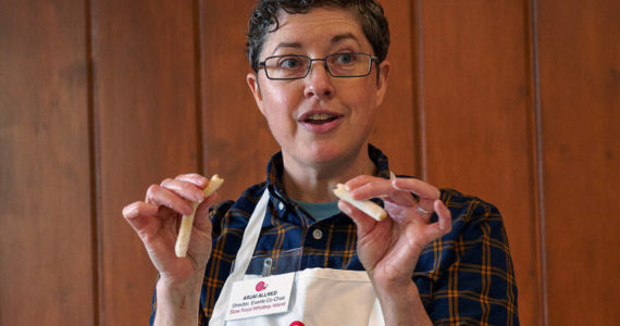 Photo by David Welton
Arjai Allred demonstrates different ways to shape endless possibility cookie dough, a recipe Allred created, at a holiday baking class in Greenbank Nov. 12.
